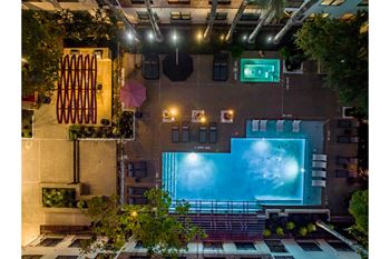 Two resort inspired swimming pools with sundeck